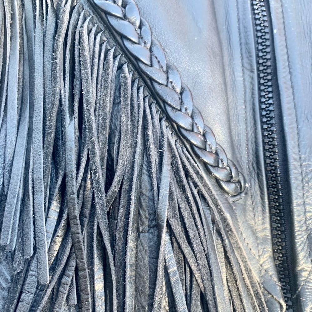 Groovy leather fringe jacket. Size small, excellent condition. Removable liner